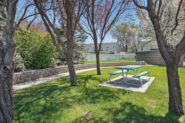 314 E 1000 N, Spanish Fork, UT 84660 - view of community with fence, a yard, and a patio