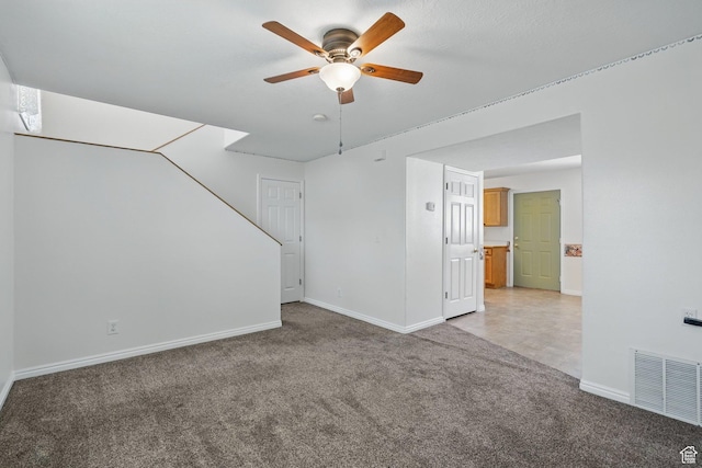 314 E 1000 N, Spanish Fork, UT 84660 - unfurnished living room with light colored carpet, ceiling fan, baseboards, and visible vents