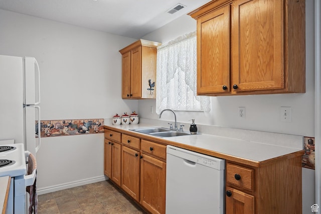 314 E 1000 N, Spanish Fork, UT 84660 - kitchen featuring light countertops, visible vents, a sink, white appliances, and brown cabinetry