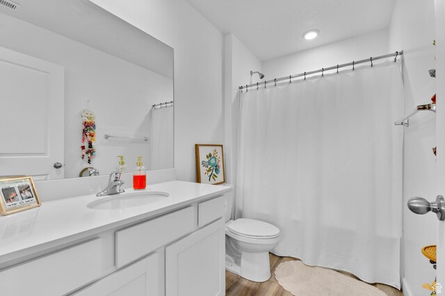1324 S 3610 E, Spanish Fork, UT 84660 - bathroom featuring recessed lighting, wood finished floors, toilet, vanity, and shower / bath combo