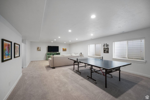 game room featuring recessed lighting, baseboards, and light carpet