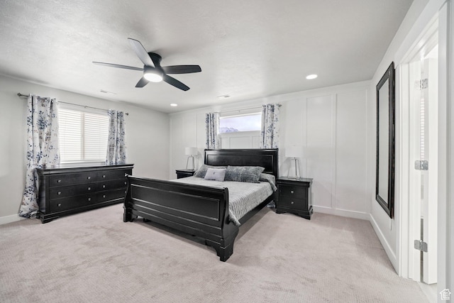 carpeted bedroom with a ceiling fan, baseboards, and recessed lighting