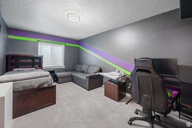 carpeted bedroom featuring a textured ceiling