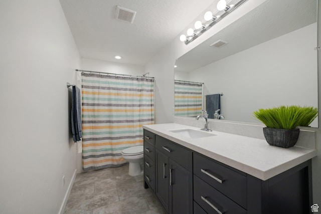 full bath with baseboards, vanity, toilet, and visible vents