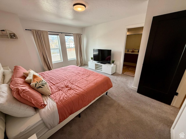 1739 S Main St E Unit 9, Salt Lake City, UT 84115 - bedroom featuring light carpet and a textured ceiling