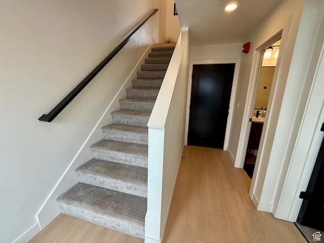 1739 S Main St E Unit 9, Salt Lake City, UT 84115 - stairway with baseboards, wood finished floors, and recessed lighting