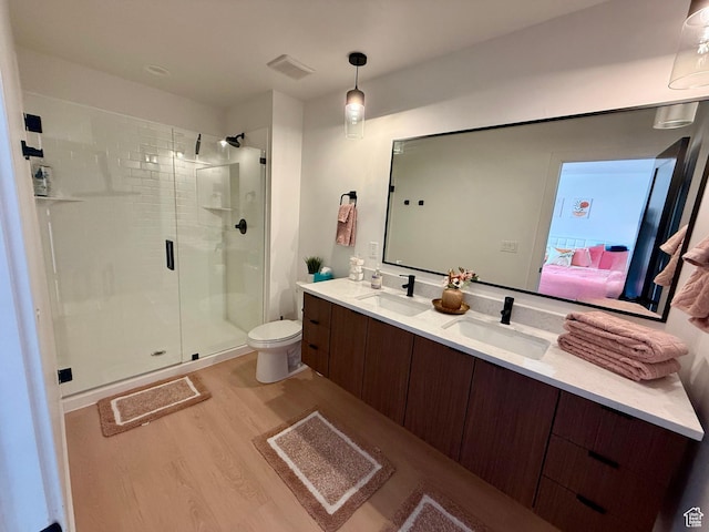 1739 S Main St E Unit 9, Salt Lake City, UT 84115 - ensuite bathroom featuring wood finished floors, a sink, a shower stall, and double vanity