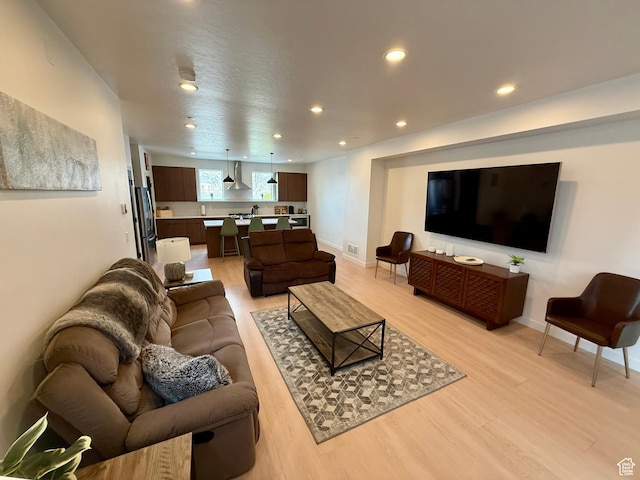 1739 S Main St E Unit 9, Salt Lake City, UT 84115 - living area with recessed lighting, light wood-style floors, visible vents, and baseboards