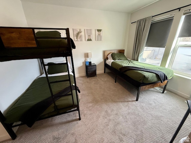1739 S Main St E Unit 9, Salt Lake City, UT 84115 - bedroom with light carpet and baseboards