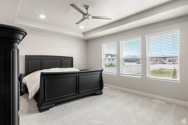 3698 S 5325 W, Hooper, UT 84315 - bedroom featuring recessed lighting, a tray ceiling, visible vents, light carpet, and baseboards