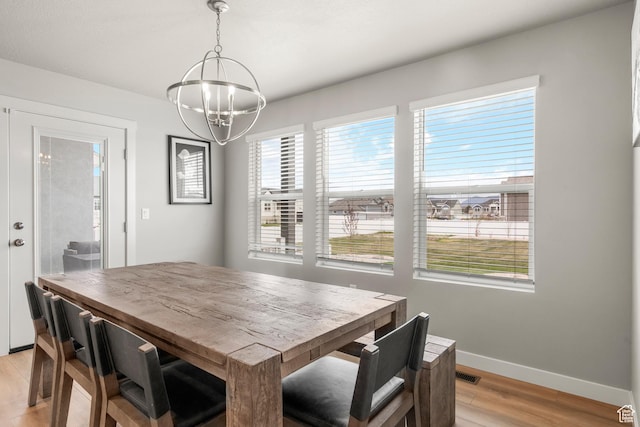 3698 S 5325 W, Hooper, UT 84315 - dining space with a wealth of natural light, a notable chandelier, light wood-type flooring, and baseboards