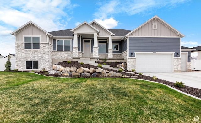 craftsman house with stone siding, board and batten siding, and a front yard