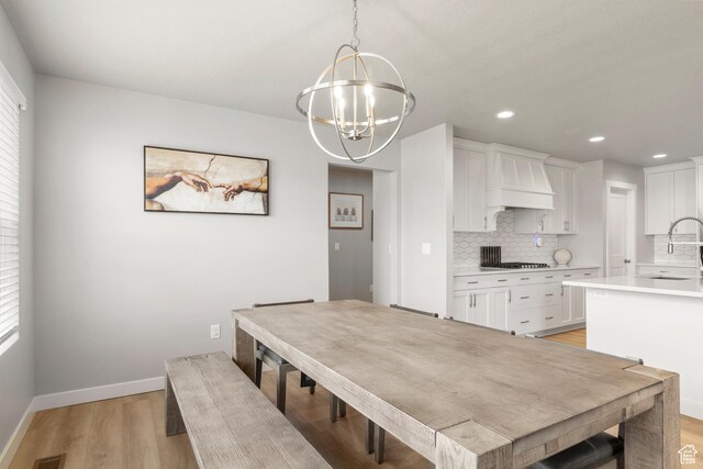 3698 S 5325 W, Hooper, UT 84315 - dining area with recessed lighting, light wood-style flooring, baseboards, and an inviting chandelier