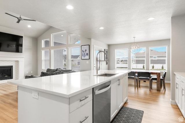 3698 S 5325 W, Hooper, UT 84315 - kitchen featuring dishwasher, open floor plan, a sink, and light countertops