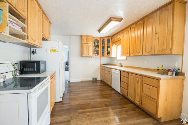 418 E 100 N, Vernal, UT 84078 - kitchen featuring light countertops, white appliances, glass insert cabinets, a textured ceiling, and dark wood-style flooring