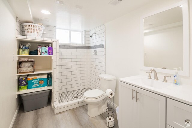 418 E 100 N, Vernal, UT 84078 - full bath featuring wood finished floors, vanity, toilet, and a stall shower