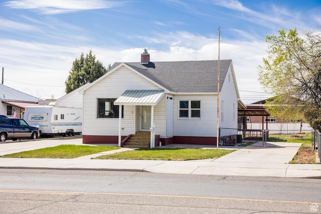 418 E 100 N, Vernal, UT 84078 - bungalow with a chimney, fence, and a shingled roof