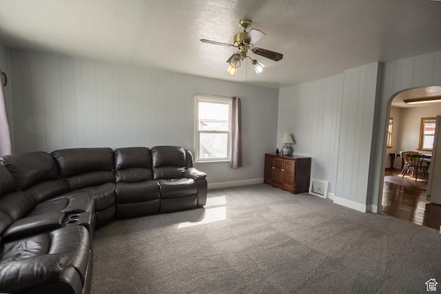 418 E 100 N, Vernal, UT 84078 - carpeted living room featuring arched walkways, visible vents, baseboards, and ceiling fan