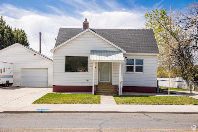 418 E 100 N, Vernal, UT 84078 - view of front of home featuring a chimney, concrete driveway, a shingled roof, fence, and entry steps