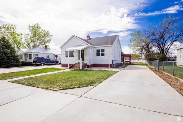 418 E 100 N, Vernal, UT 84078 - bungalow-style home with concrete driveway, a front lawn, and fence