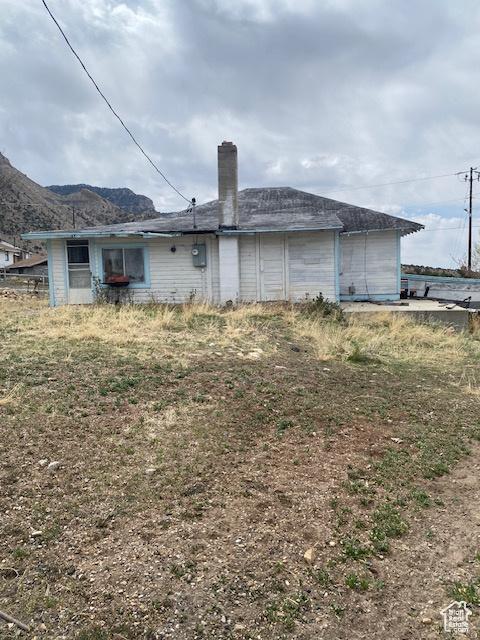 170 W Main St, East Carbon, UT 84520 - back of property with a chimney and a mountain view
