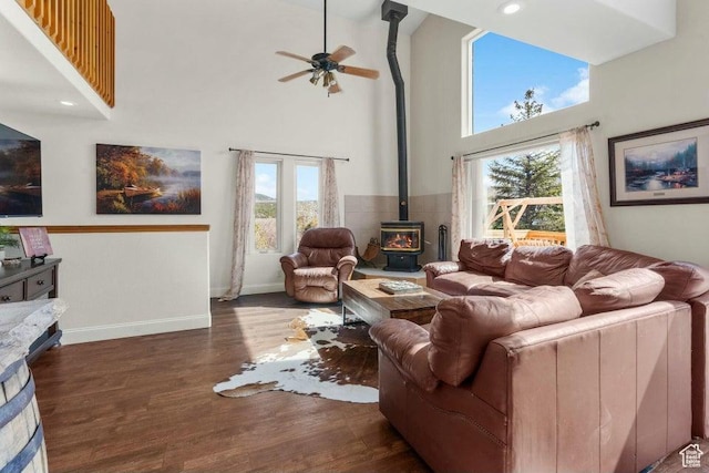 770 W Carter Dr, Pine Valley, UT 84781 - living room with a wood stove, a ceiling fan, a wealth of natural light, and a high ceiling