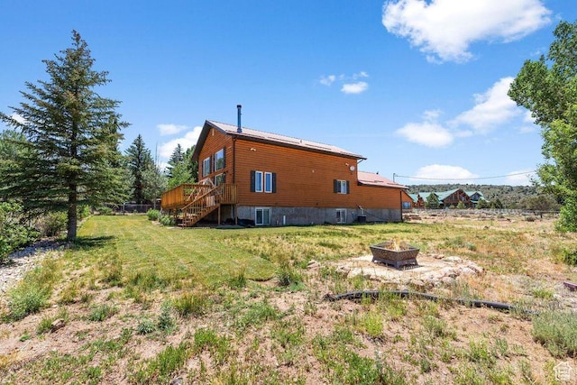 770 W Carter Dr, Pine Valley, UT 84781 - exterior space with stairs, central AC, a wooden deck, a lawn, and an outdoor fire pit