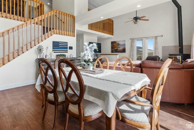 770 W Carter Dr, Pine Valley, UT 84781 - dining space with ceiling fan, wood finished floors, a towering ceiling, and a wood stove