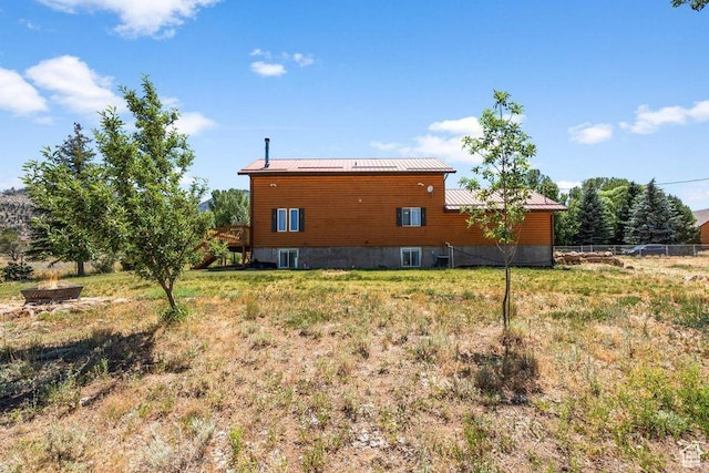 770 W Carter Dr, Pine Valley, UT 84781 - rear view of property featuring metal roof, fence, and a deck