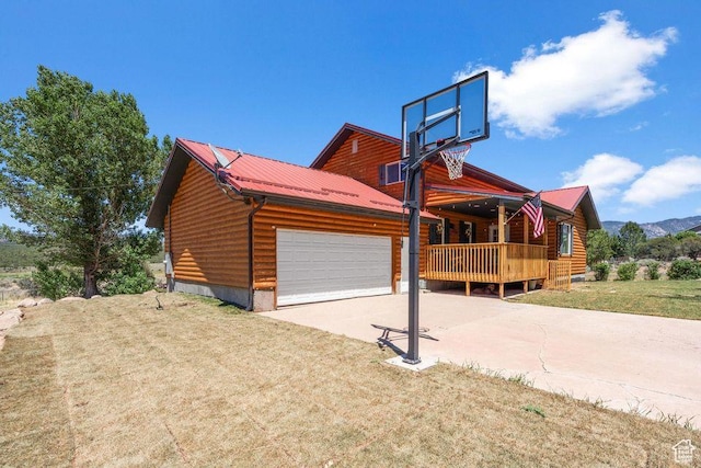 770 W Carter Dr, Pine Valley, UT 84781 - view of front of property with a garage, a front lawn, metal roof, and concrete driveway