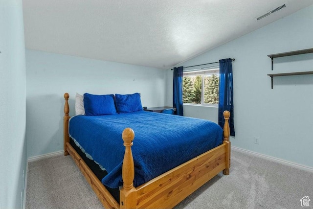 770 W Carter Dr, Pine Valley, UT 84781 - carpeted bedroom with vaulted ceiling, a textured ceiling, visible vents, and baseboards
