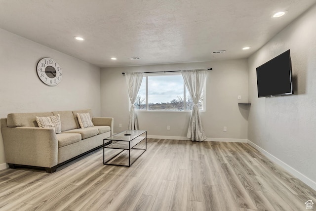 3306 N Fairfield Rd, Layton, UT 84041 - living area featuring recessed lighting, baseboards, visible vents, and light wood-style flooring