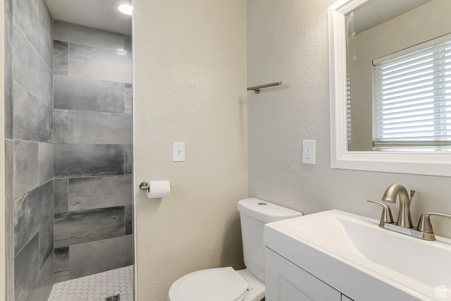 3306 N Fairfield Rd, Layton, UT 84041 - bathroom with toilet, tiled shower, and vanity