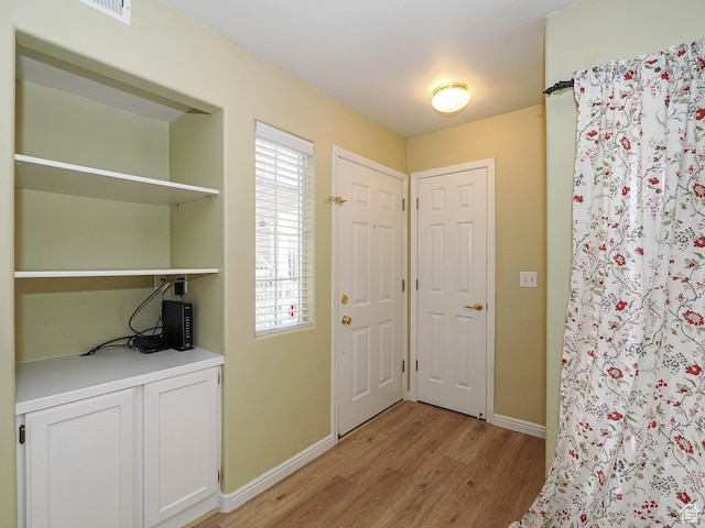 3832 S Big River Way W Unit 1, Salt Lake City, UT 84119 - entryway with baseboards and light wood-type flooring