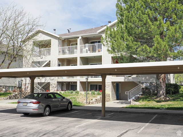 3832 S Big River Way W Unit 1, Salt Lake City, UT 84119 - view of property with stairs and covered parking