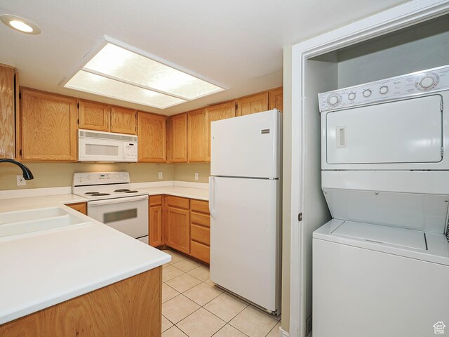 3832 S Big River Way W Unit 1, Salt Lake City, UT 84119 - kitchen featuring a sink, stacked washer and clothes dryer, white appliances, light countertops, and light tile patterned floors