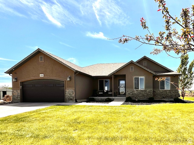 view of front of home featuring stone siding, an attached garage, driveway, and stucco siding
