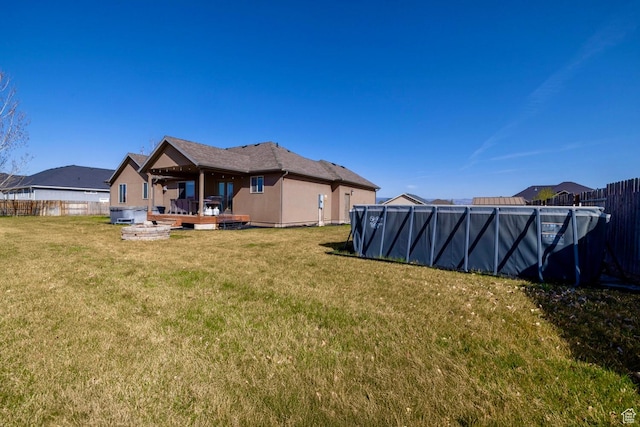 1808 E 2000 S, Naples, UT 84078 - back of property featuring fence, a wooden deck, a lawn, and a swimming pool