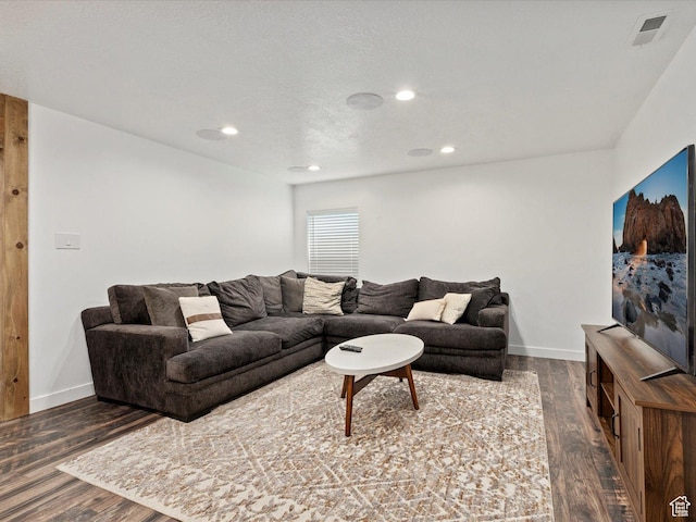 living room with baseboards, visible vents, recessed lighting, and dark wood-style floors