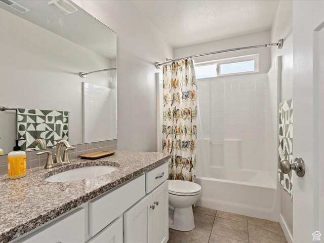bathroom with vanity, visible vents, shower / bathtub combination with curtain, and toilet