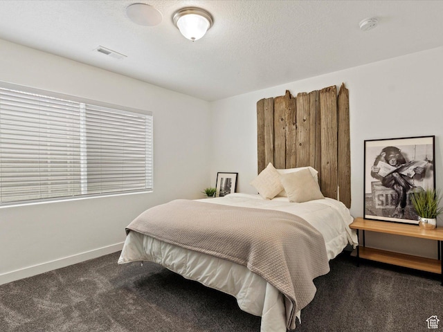 carpeted bedroom with baseboards and visible vents