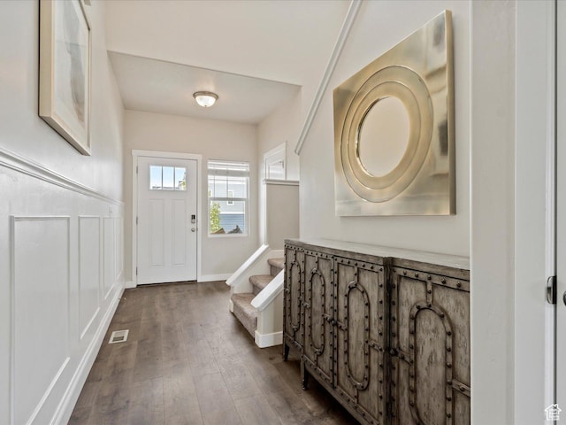 interior space with stairs and dark wood-style floors