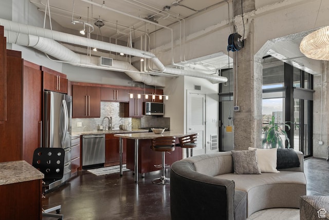 328 W 200 S Unit 505, Salt Lake City, UT 84101 - living area featuring concrete floors, a towering ceiling, and visible vents