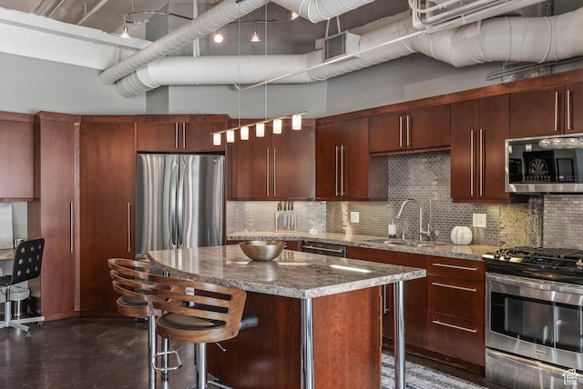 328 W 200 S Unit 505, Salt Lake City, UT 84101 - kitchen featuring backsplash, a kitchen bar, appliances with stainless steel finishes, and a sink