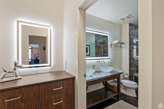 328 W 200 S Unit 505, Salt Lake City, UT 84101 - full bath with a shower, visible vents, vanity, and toilet