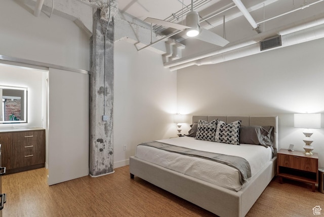 328 W 200 S Unit 505, Salt Lake City, UT 84101 - bedroom featuring visible vents and light wood-style flooring
