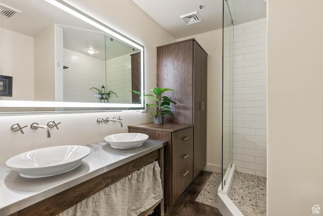 328 W 200 S Unit 505, Salt Lake City, UT 84101 - bathroom with visible vents, a stall shower, and a sink
