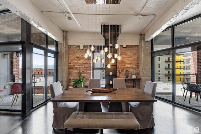 328 W 200 S Unit 505, Salt Lake City, UT 84101 - dining area featuring concrete floors and brick wall