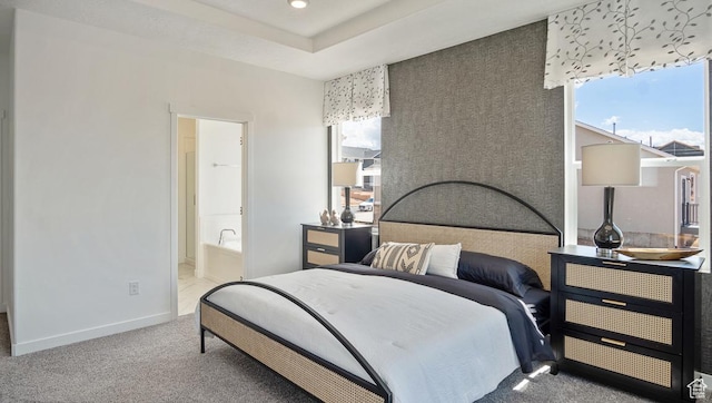 carpeted bedroom featuring baseboards, recessed lighting, and connected bathroom