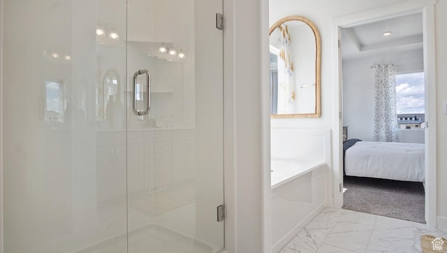 ensuite bathroom featuring a bath, marble finish floor, connected bathroom, and a shower stall